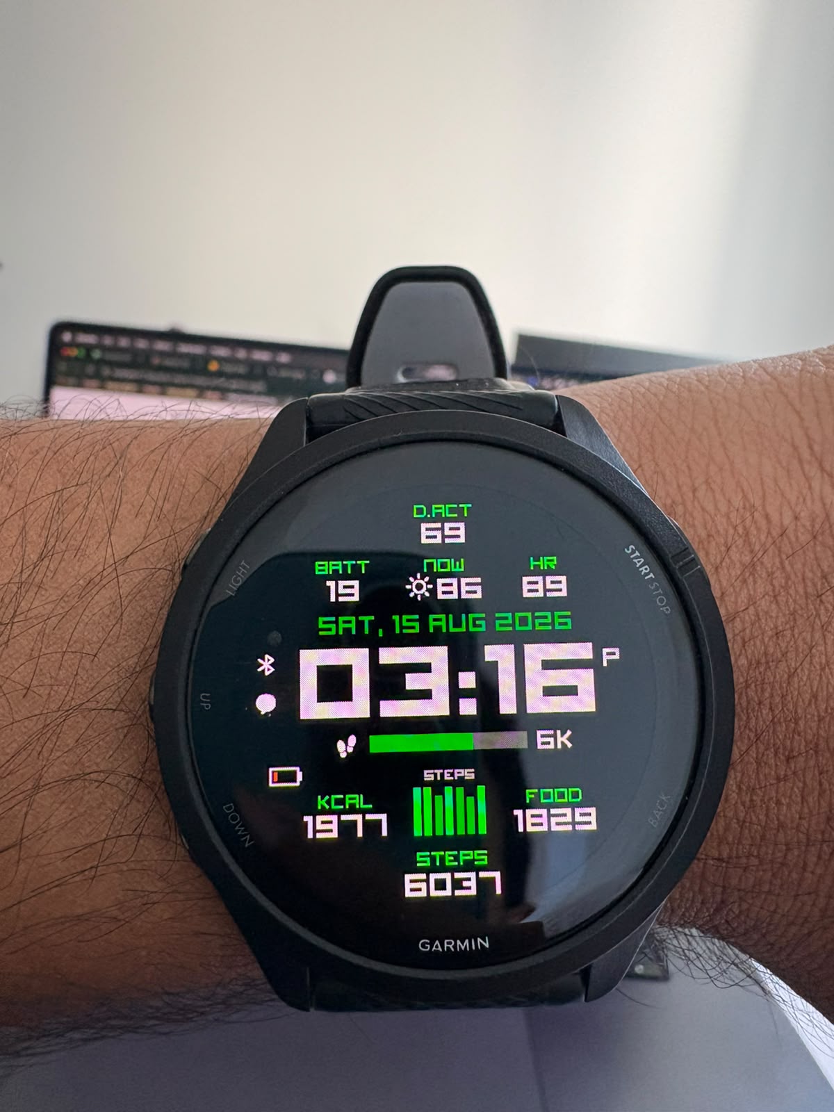 The watch face showing FOOD 1829 next to steps, heart rate and calories burned.